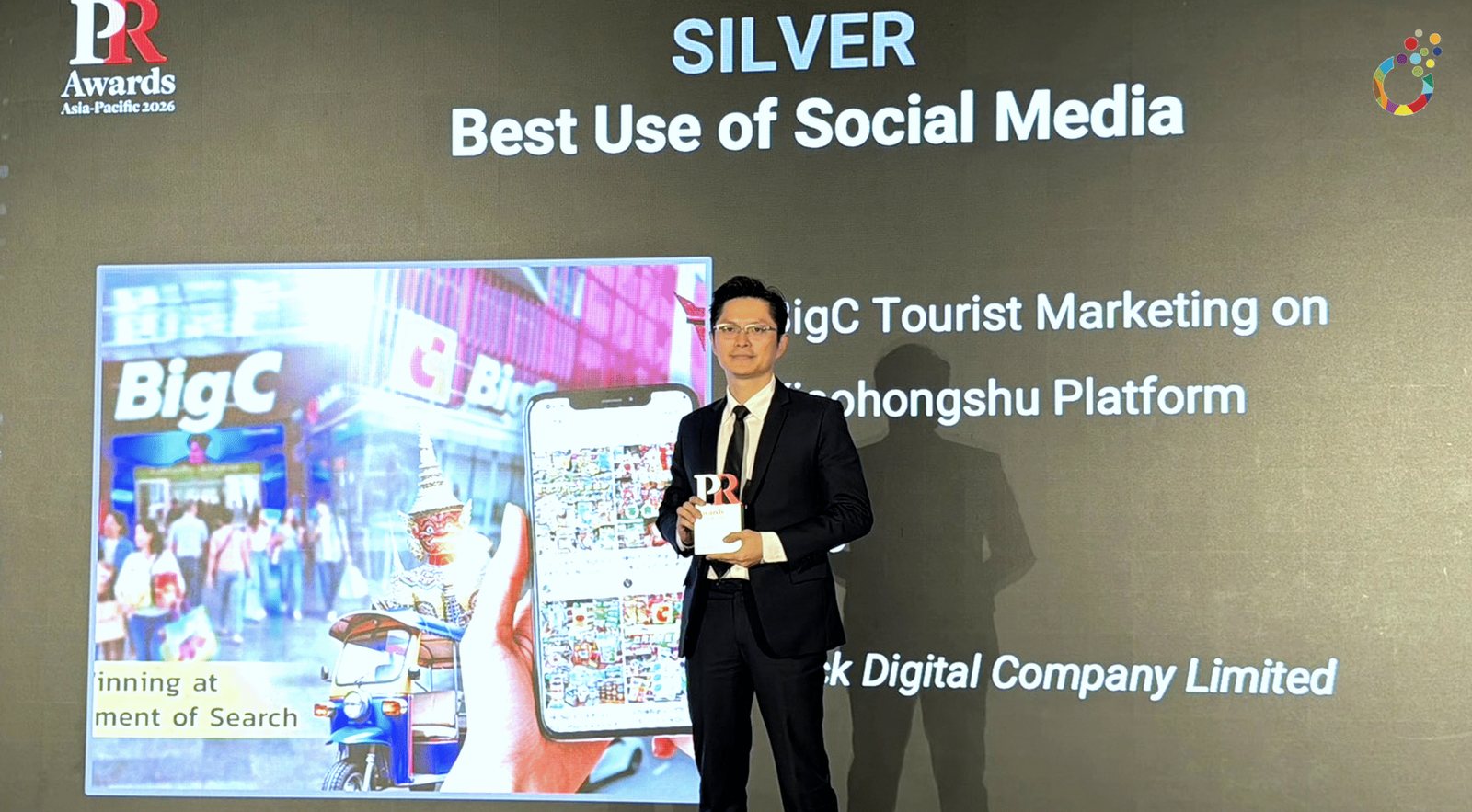 PR Awards Asia-Pacific 2026 stage screen announcing Silver, Best Use of Social Media, for Big C Tourist Marketing on Xiaohongshu by Klick Digital, with the trophy on stage